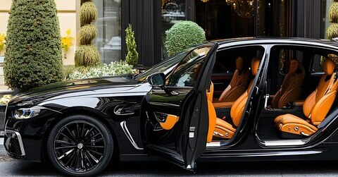 BMW SUV with all doors open showcasing both pristine exterior and luxury interior